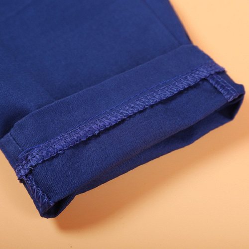 Close-up of blue pants hem stitching detail